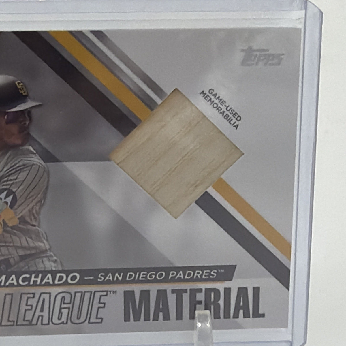 Close-up of Manny Machado Major League Material card showing the bat memorabilia