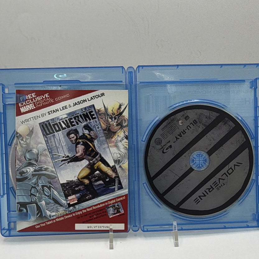 Open The Wolverine case showing included printed materials and physical discs