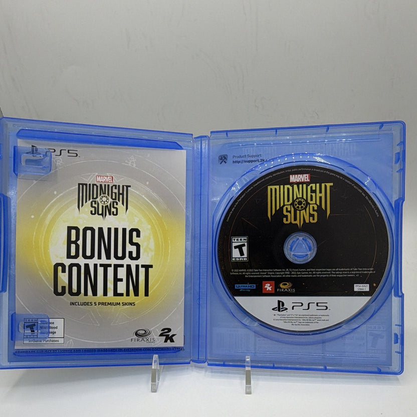 Open Marvel's Midnight Suns Enhanced Edition PS5 case with game disc and expired bonus-content insert