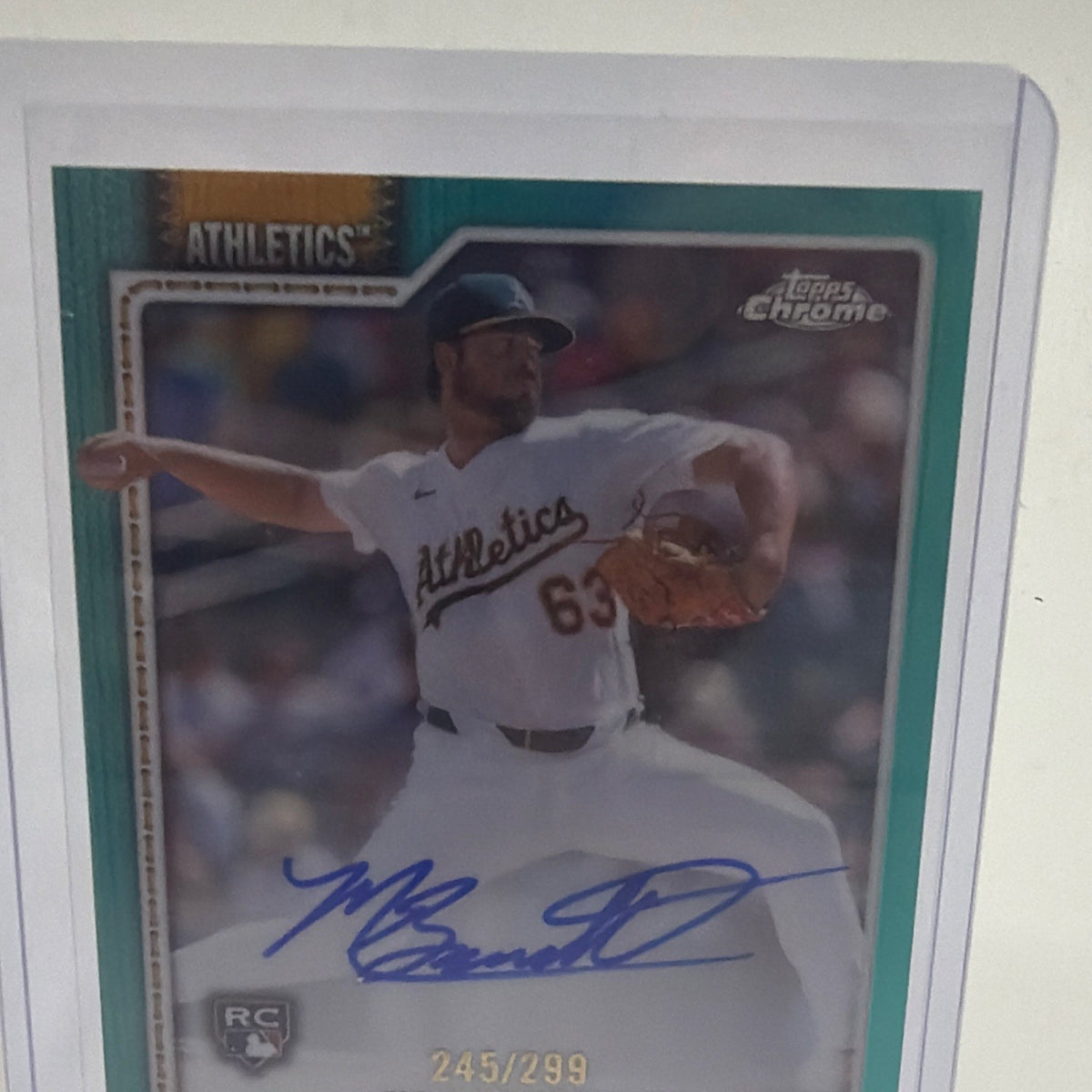 Angled front view of Mason Barnett Topps Chrome Teal Refractor rookie autograph numbered 245/299