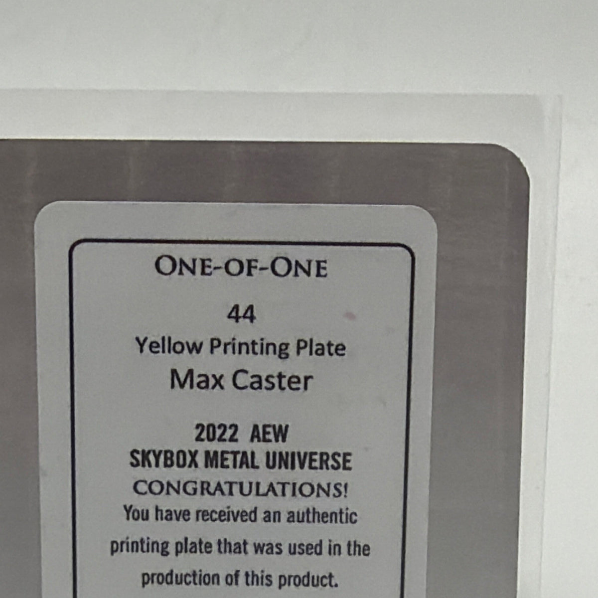 Close-up of the reverse certification on Max Caster Yellow Printing Plate 1/1