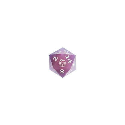 twenty sided die with the Jester Lavorre icon of a cupcake pastry on the 20 side of the d20