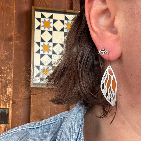 butterfly wing earrings, stained glass resin earrings, lightweight dangle earrings, nature inspired jewelry, butterfly jewelry for women, handmade resin earrings, stainless steel earrings, whimsical fashion accessories, gift for nature lovers, artisan butterfly earrings, unique statement earrings, everyday wear earrings, modern boho earrings, colorful resin earrings, forestcore jewelry, fairycore accessories, spring jewelry trends, handcrafted earrings USA, Rogue & Rye earrings