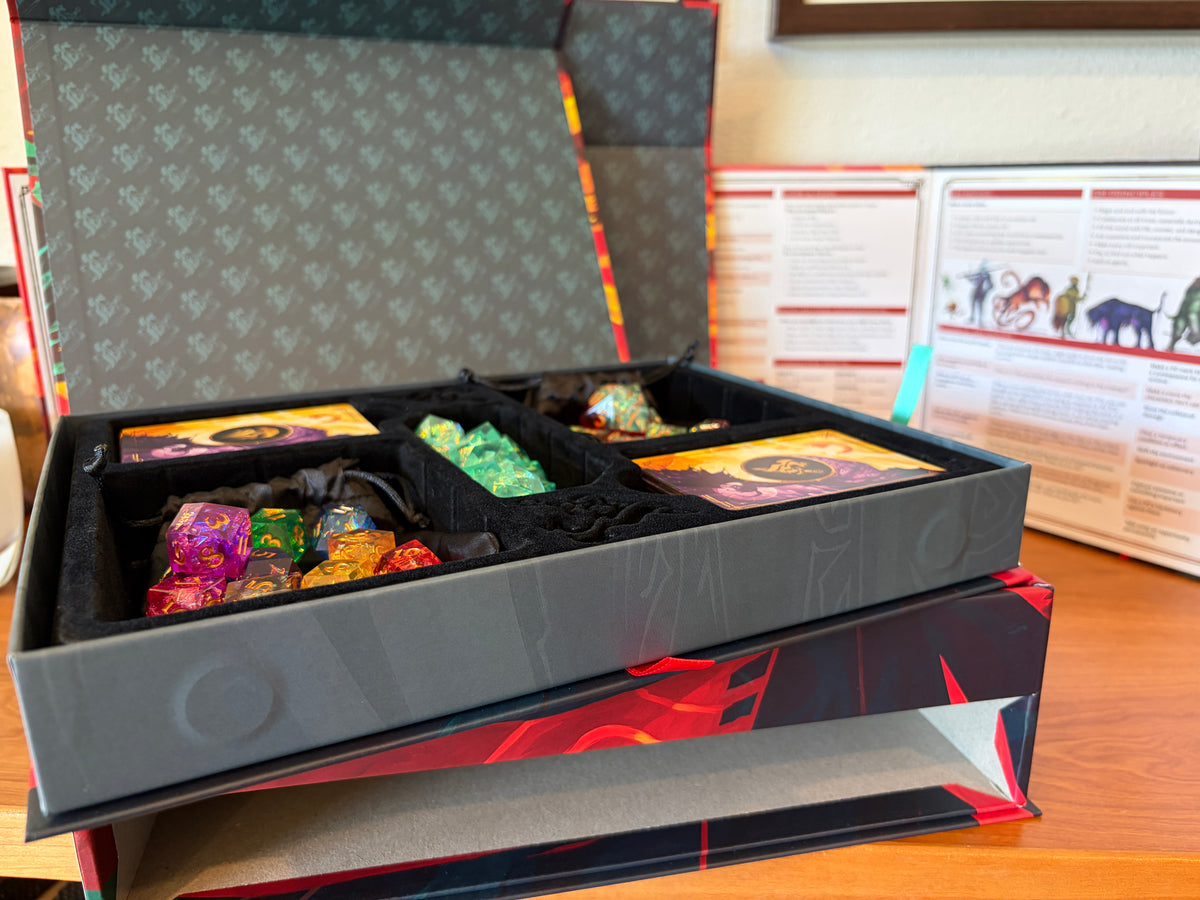 Premium organizer tray with deluxe dice, card decks, and storage compartments from the Daggerheart Hope & Fear Deluxe Edition.