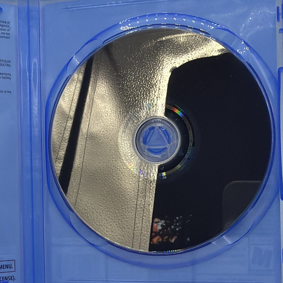 Back surface of the Resident Evil 4 PlayStation 5 game disc