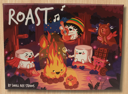 Illustrated product packaging with characters around a campfire, featuring the game title 'Roast'.