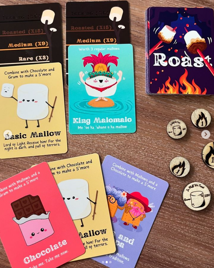 Collection of colorful cards with cartoon characters and text on a wooden surface