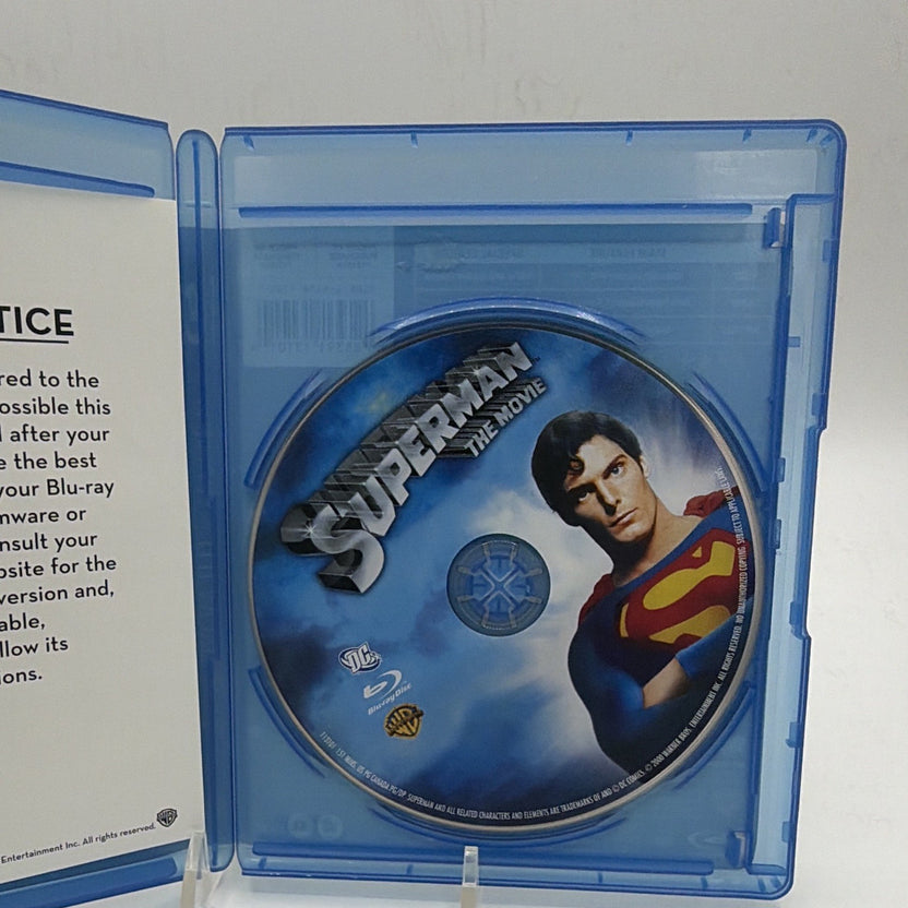 Open Superman: The Movie Blu-ray case showing the disc and included printed booklet