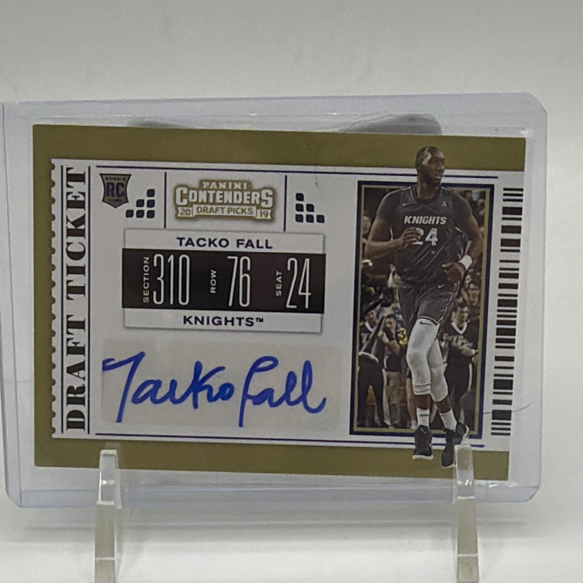 Front of 2019-20 Panini Contenders Draft Picks Tacko Fall #118 College Ticket rookie autograph card in protective holder