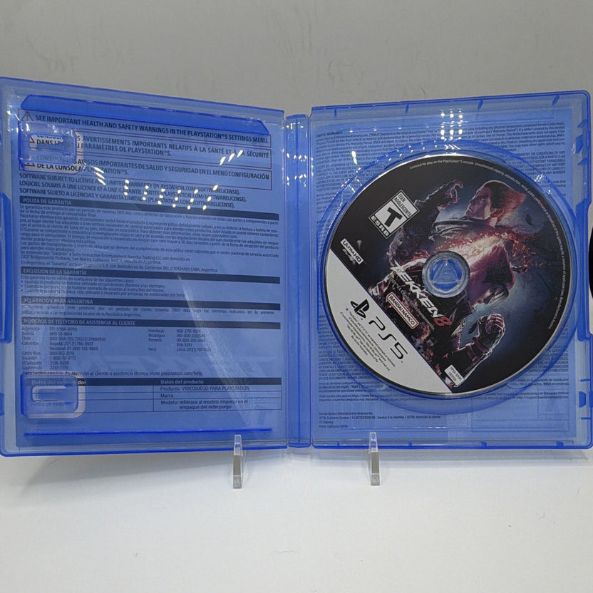 Open Tekken 8 PS5 case showing game disc and no instruction booklet