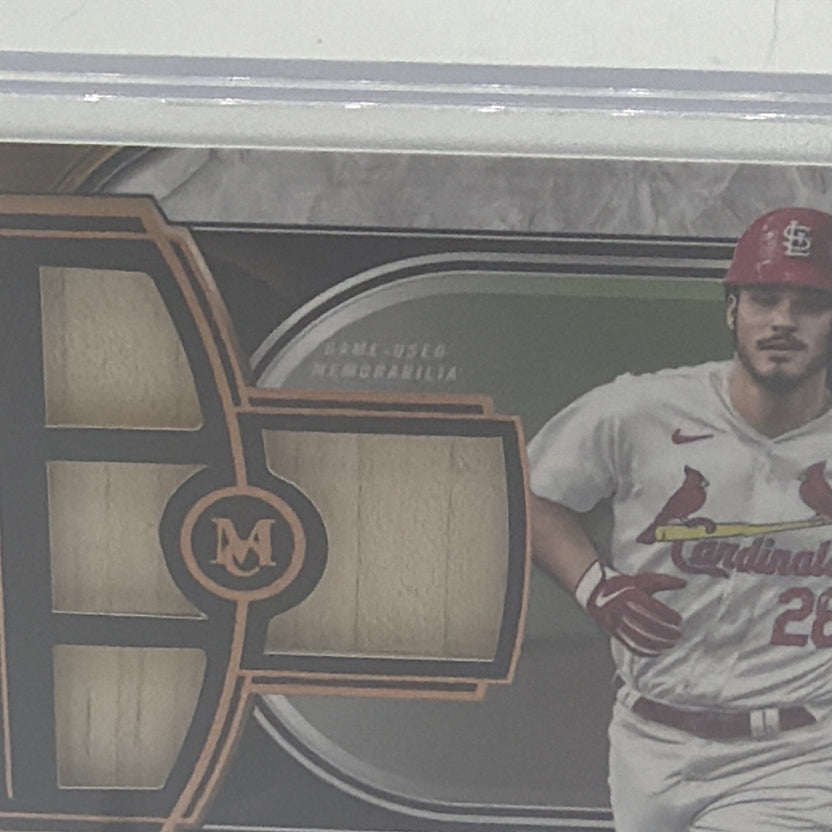 Close-up of four memorabilia windows on Nolan Arenado Topps Museum Collection card SPQR-NA