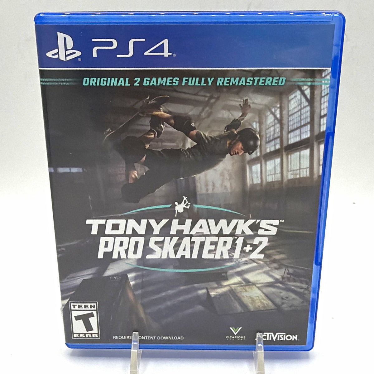 Front of Tony Hawk's Pro Skater 1 + 2 game case for PlayStation 4