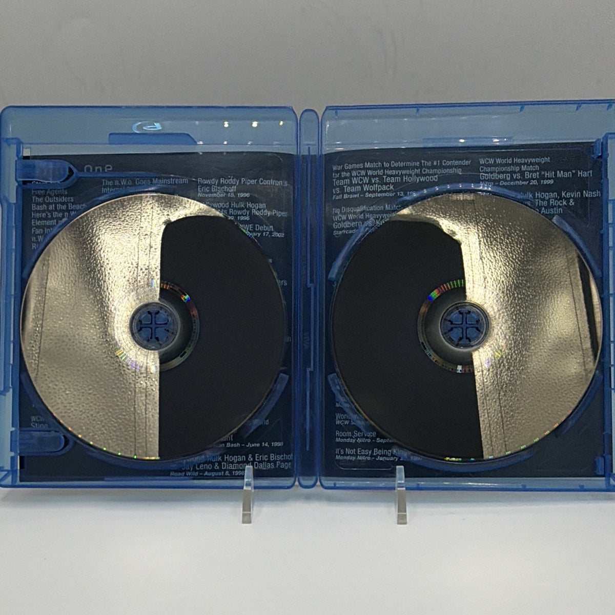 Open WWE nWo: The Revolution case showing the reflective sides of both Blu-ray discs