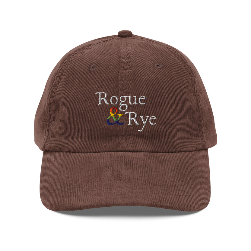 and pride hat, lgbtq corduroy cap, pride embroidered hat, queer and questioning cap, rogue and rye pride, inclusive pride apparel, outright international donation, and hat message, unstructured low profile cap, soft corduroy hat, queer pride gear, gender inclusive pride, thoughtful pride gift, adjustable pride cap, rogue and rye hat, embroidered message hat, live outside the binary, pride fashion statement, soft cotton pride hat