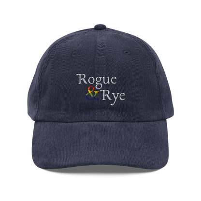 and pride hat, lgbtq corduroy cap, pride embroidered hat, queer and questioning cap, rogue and rye pride, inclusive pride apparel, outright international donation, and hat message, unstructured low profile cap, soft corduroy hat, queer pride gear, gender inclusive pride, thoughtful pride gift, adjustable pride cap, rogue and rye hat, embroidered message hat, live outside the binary, pride fashion statement, soft cotton pride hat