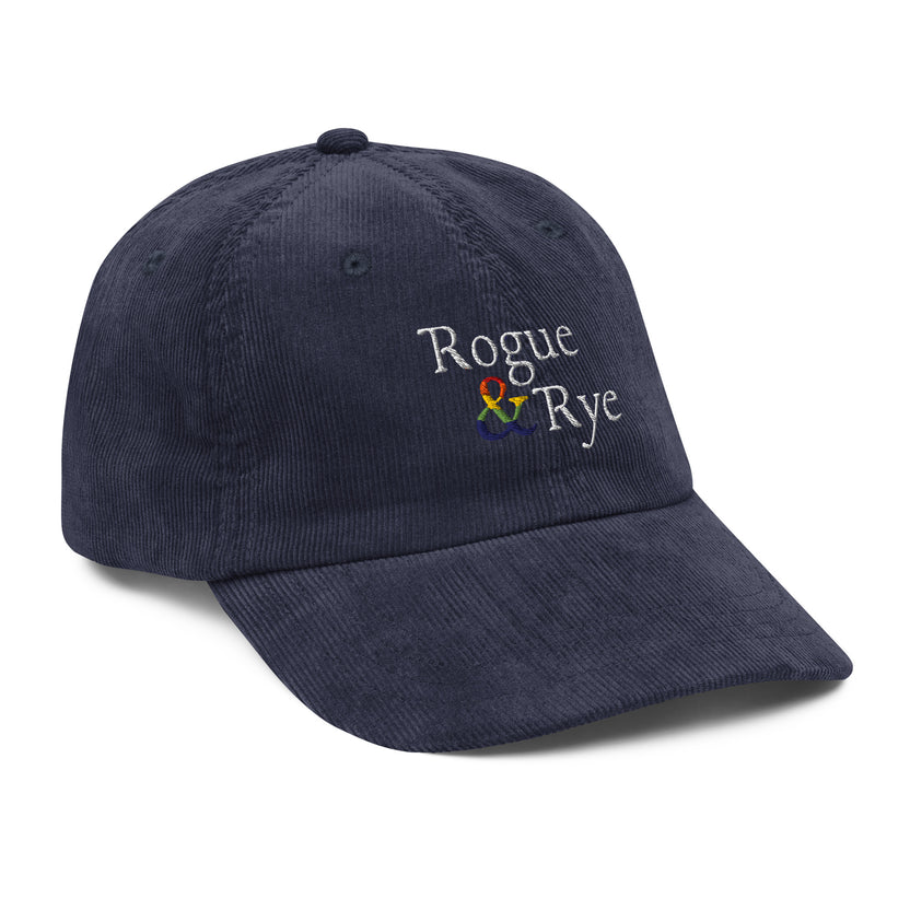 and pride hat, lgbtq corduroy cap, pride embroidered hat, queer and questioning cap, rogue and rye pride, inclusive pride apparel, outright international donation, and hat message, unstructured low profile cap, soft corduroy hat, queer pride gear, gender inclusive pride, thoughtful pride gift, adjustable pride cap, rogue and rye hat, embroidered message hat, live outside the binary, pride fashion statement, soft cotton pride hat