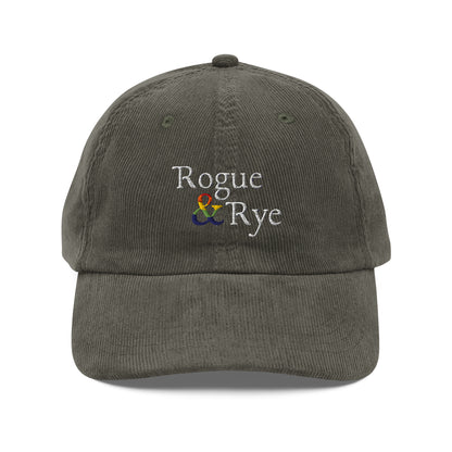 and pride hat, lgbtq corduroy cap, pride embroidered hat, queer and questioning cap, rogue and rye pride, inclusive pride apparel, outright international donation, and hat message, unstructured low profile cap, soft corduroy hat, queer pride gear, gender inclusive pride, thoughtful pride gift, adjustable pride cap, rogue and rye hat, embroidered message hat, live outside the binary, pride fashion statement, soft cotton pride hat