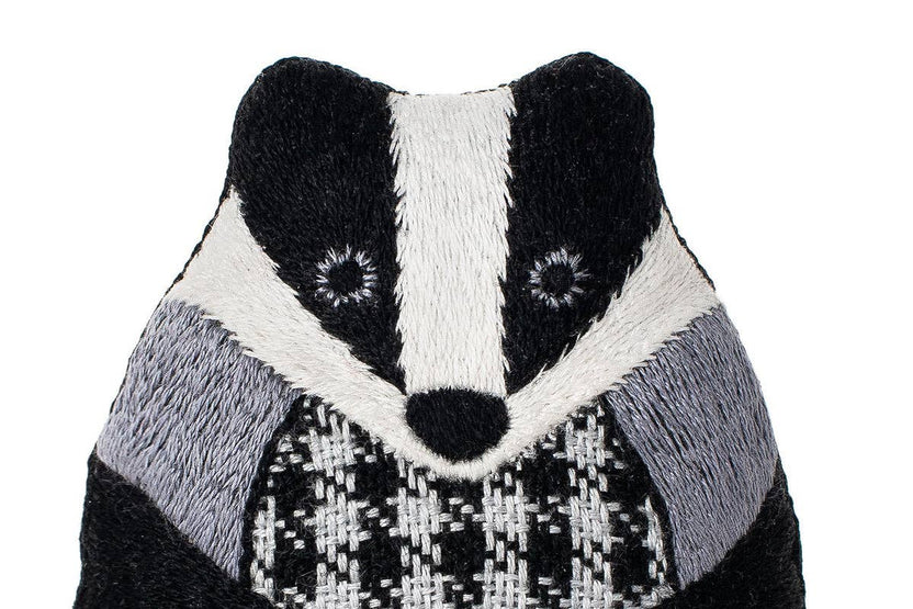 badger embroidery kit, embroidered doll craft kit, Kiriki Press embroidery, Level 3 embroidery pattern, animal embroidery project, hand embroidery for beginners, stitched badger plush, screen printed embroidery fabric, DMC floss kit, mindful stitching craft