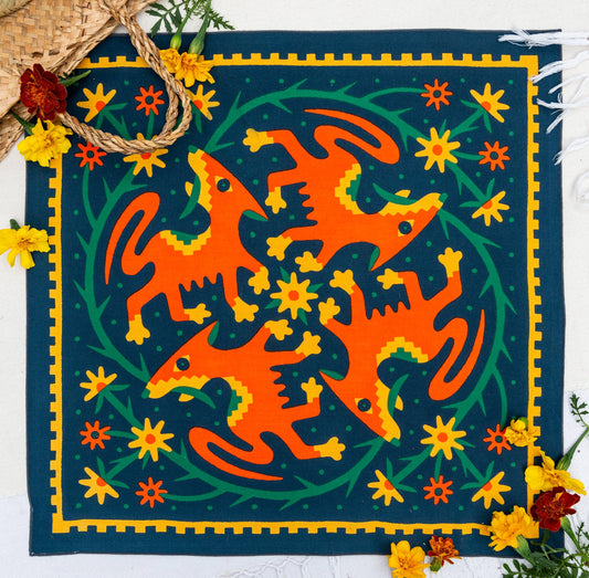 Endless Bloom bandana by Bandits Bandanas featuring four stylized orange foxes arranged in a circular floral pattern on a deep teal background with yellow flowers