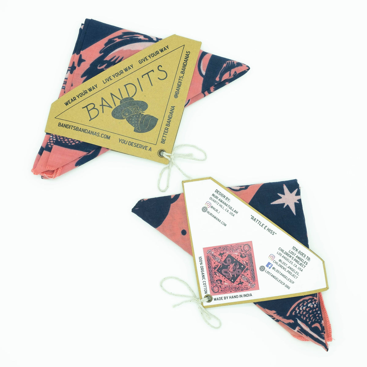Bandits Rattle & Hiss bandana by Nuri Amanatullah folded with the Bandits hang tag, front and back packaging cards displayed.