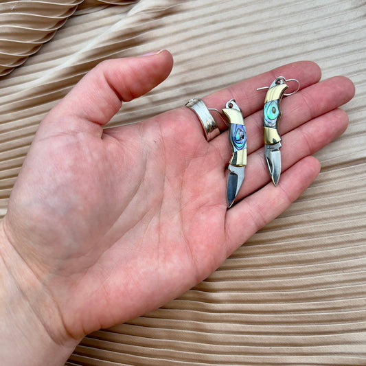 abalone knife earrings, billie mini knife earrings, functional knife earrings, silver mini blade earrings, abalone jewelry with blade, real knife earrings, abalone pocket knife earrings, rogue aesthetic earrings, sterling silver ear wire earrings, unique abalone inlay earrings, edgy statement earrings, utility jewelry earrings, pocket knife fashion, fantasy inspired jewelry, knife earrings, gift