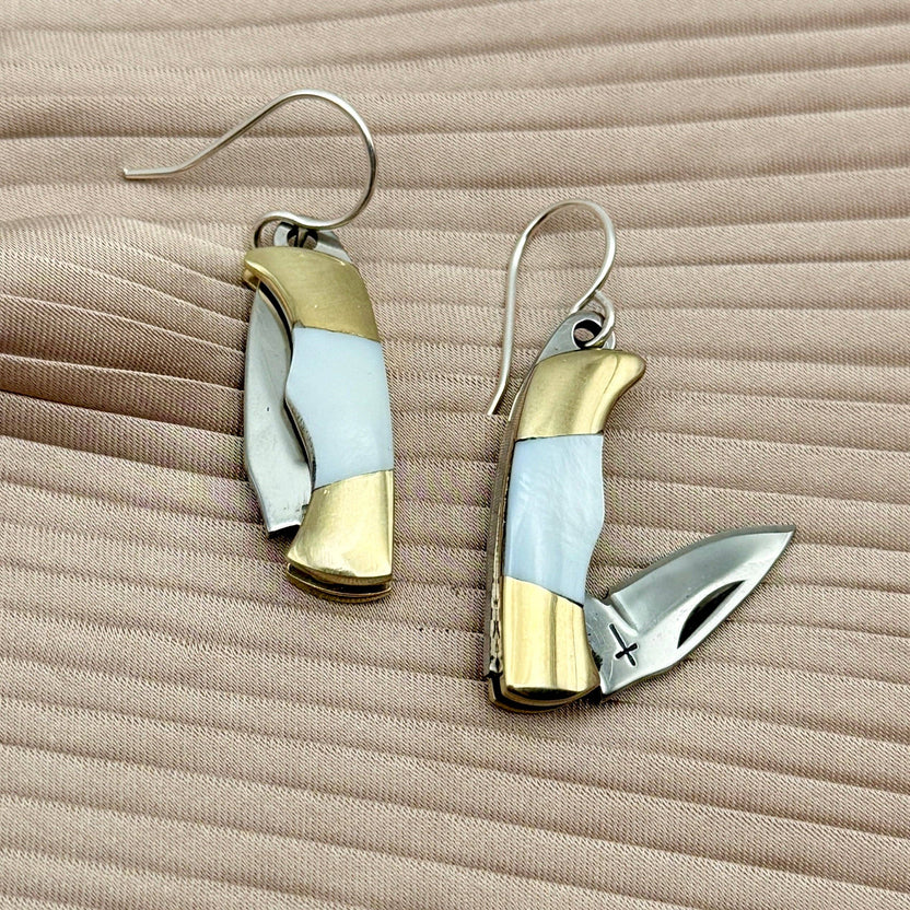 mini knife earrings, mother of pearl knife earrings, billie pocket knife earrings, silver mini blade earrings, functional knife earrings, edgy jewelry with blade, pocket knife earrings silver, dnd rogue fashion accessories, utility jewelry earrings, mother of pearl blade jewelry, tiny knife earrings real, sterling silver ear wire earrings, surprise statement earrings, fashion with a sharp twist, rebellious jewelry design
