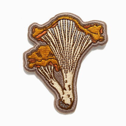chanterelle mushroom patch, embroidered mushroom patch, golden mushroom iron-on, fungi sew-on patch, woodland embroidery patch, textured chanterelle applique, backpack mushroom patch, jean jacket patch, forager gift, artisan embroidered patch, blackbird letterpress patch, cottagecore mushroom accessory, nature lover patch, rogue & rye mushroom patch, embroidered chanterelle design