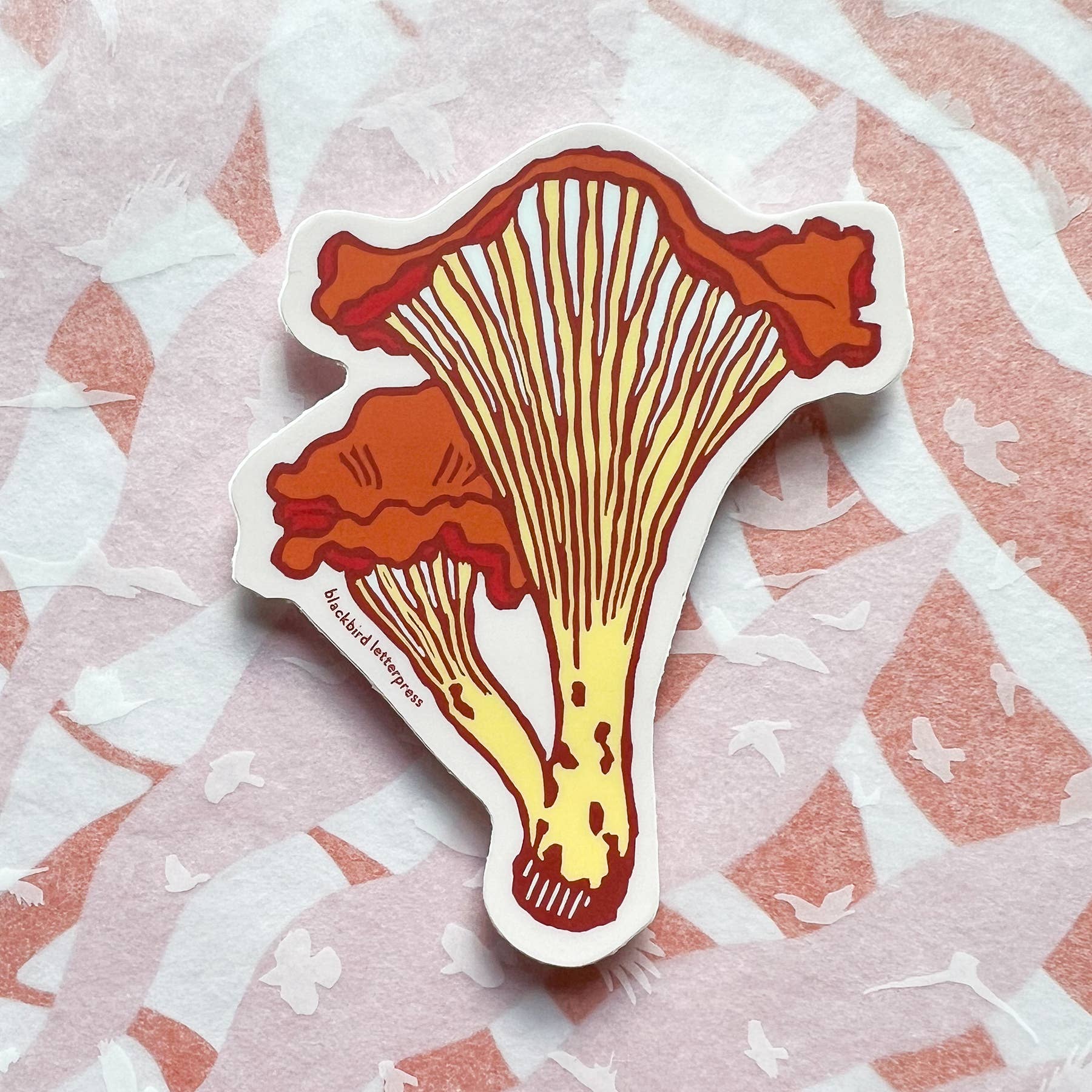 chanterelle mushroom sticker, mushroom vinyl sticker, fungi vinyl decal, linocut mushroom illustration, Élise Lassonde art, Blackbird Letterpress sticker, matte vinyl die-cut sticker, waterproof mushroom sticker, weatherproof uv-protected sticker, forager gift, forest mushroom art, botanical sticker, durable laptop decal, water bottle sticker, artisan paper goods, small-batch maker sticker, Rogue & Rye sticker collection, wild mushroom illustration, made in USA vinyl sticker