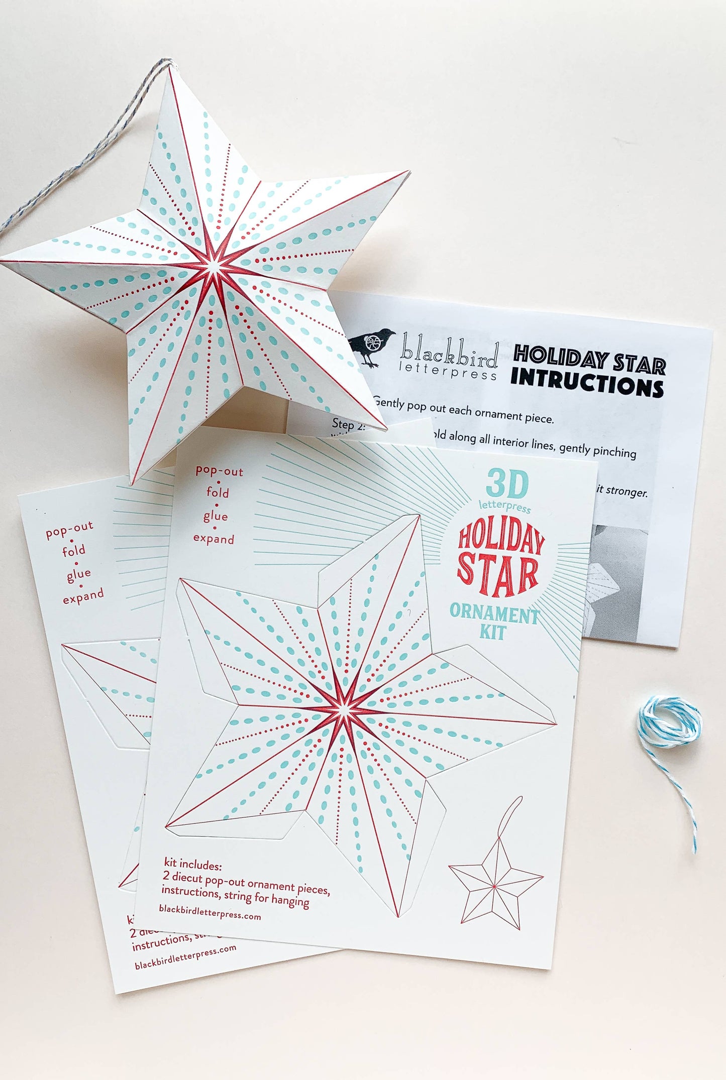 dotted holiday star kit, diy star ornament, letterpress holiday ornament, winter craft kit, recycled paper ornament, light blue and red letterpress, pop-out star craft, christmas diy paper craft, blackbird letterpress ornament kit, holiday craft for kids and adults, 3d paper star ornament, gift topper idea, handmade holiday décor, rogue & rye craft collection, easy diy holiday ornament