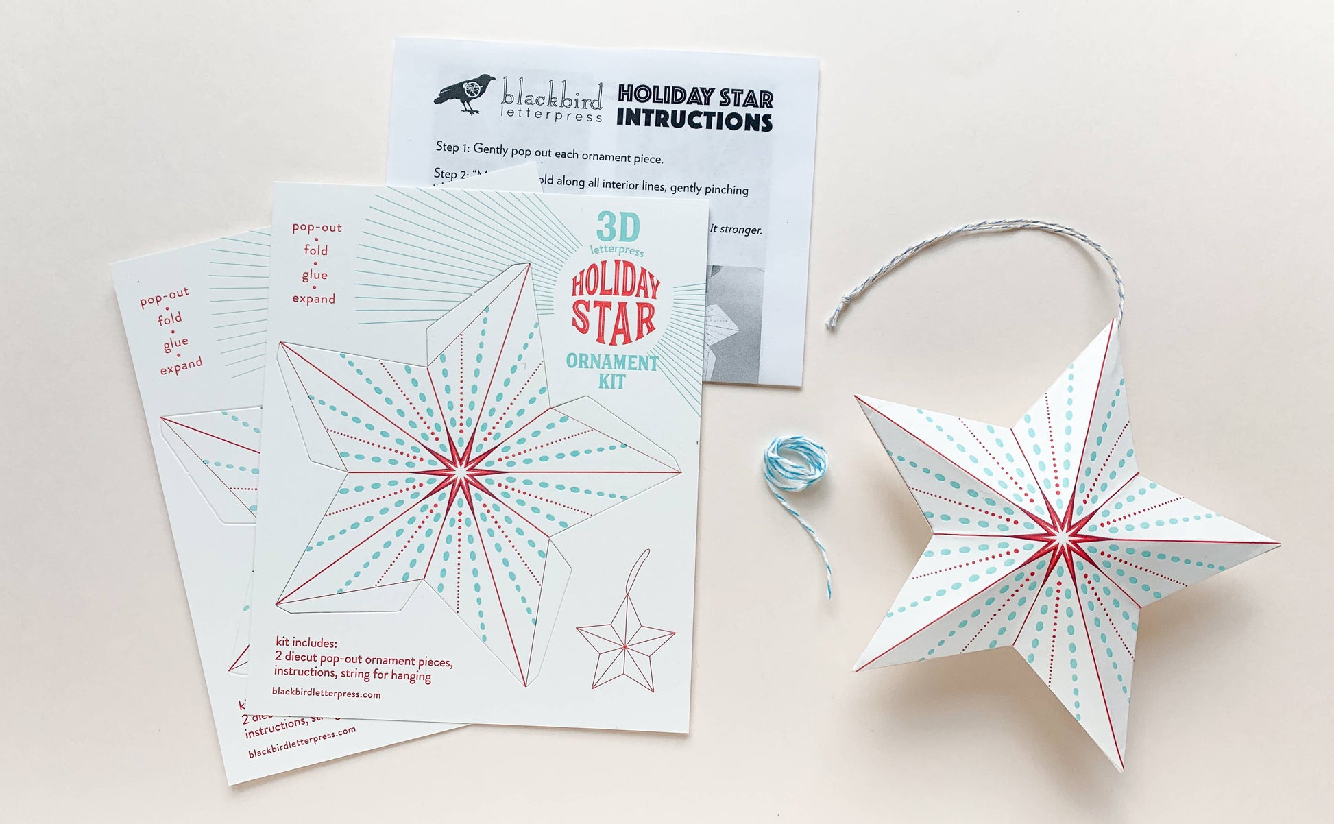 dotted holiday star kit, diy star ornament, letterpress holiday ornament, winter craft kit, recycled paper ornament, light blue and red letterpress, pop-out star craft, christmas diy paper craft, blackbird letterpress ornament kit, holiday craft for kids and adults, 3d paper star ornament, gift topper idea, handmade holiday décor, rogue & rye craft collection, easy diy holiday ornament