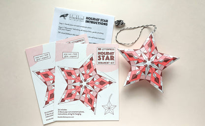 geometric holiday star kit, diy star ornament, neon red letterpress ornament, holiday paper craft kit, christmas diy craft, blackbird letterpress ornament kit, recycled white paper craft, pop-out star ornament, modern holiday décor, fold and glue ornament, handmade holiday craft kit, seasonal crafting project, vibrant holiday ornament, rogue & rye craft collection, 3d paper star ornament