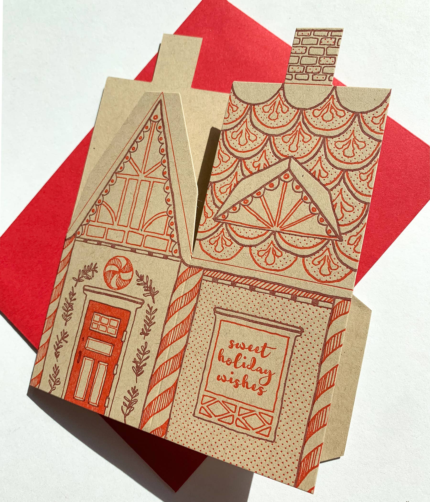gingerbread house card, holiday 3D house card, letterpress gingerbread card, foldable gingerbread house, kraft paper letterpress, die-cut Christmas card, buildable holiday card, miniature gingerbread house, festive letterpress stationery, artisan holiday card, displayable greeting card, holiday keepsake card, Blackbird Letterpress holiday collection, Rogue & Rye holiday cards, A2 Christmas card, Élise Lassonde illustration, paper craft gingerbread house
