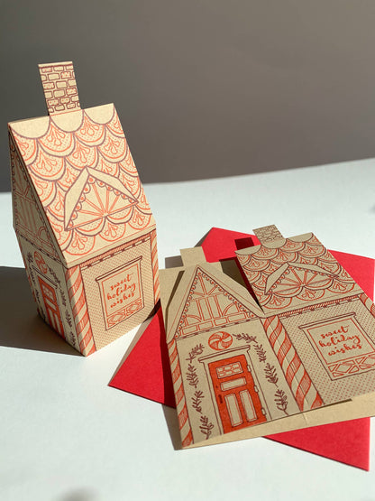 gingerbread house card, holiday 3D house card, letterpress gingerbread card, foldable gingerbread house, kraft paper letterpress, die-cut Christmas card, buildable holiday card, miniature gingerbread house, festive letterpress stationery, artisan holiday card, displayable greeting card, holiday keepsake card, Blackbird Letterpress holiday collection, Rogue & Rye holiday cards, A2 Christmas card, Élise Lassonde illustration, paper craft gingerbread house