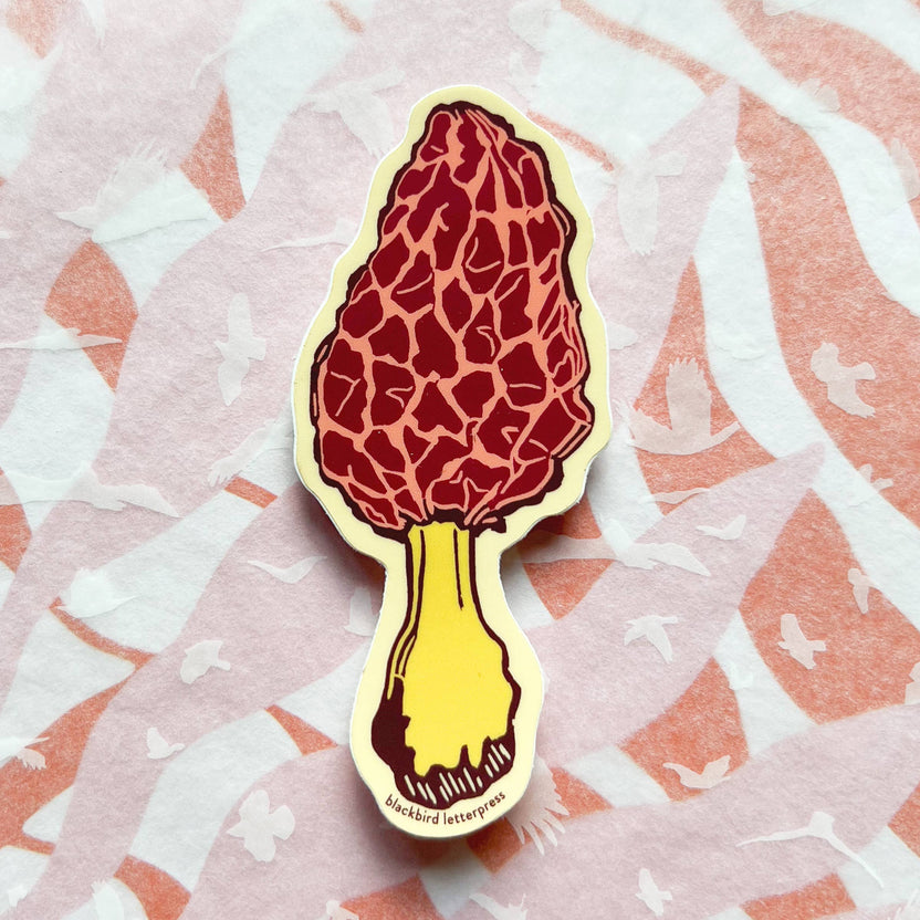 morel mushroom sticker, morel vinyl sticker, linocut mushroom illustration, Élise Lassonde artwork, Blackbird Letterpress sticker, matte vinyl die-cut sticker, waterproof mushroom sticker, weatherproof vinyl decal, forager gift, morel fungi art, botanical mushroom sticker, durable laptop sticker, water bottle decal, artisan paper goods, mushroom foraging art, small-batch maker sticker, Rogue & Rye sticker collection, woodland mushroom illustration, made in USA vinyl sticker