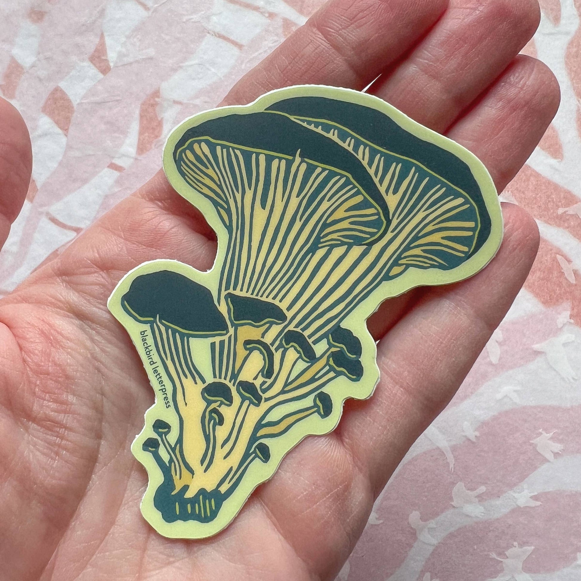 oyster mushroom sticker, mushroom vinyl sticker, linocut mushroom illustration, Élise Lassonde artwork, Blackbird Letterpress sticker, matte vinyl die-cut sticker, waterproof mushroom sticker, weatherproof uv-protected sticker, fungi lover decal, botanical mushroom art, forest mushroom sticker, durable laptop decal, water bottle sticker, artisan stationery sticker, handmade illustration sticker, small-batch maker, Rogue & Rye sticker collection, oyster fungi art, made in USA vinyl sticker