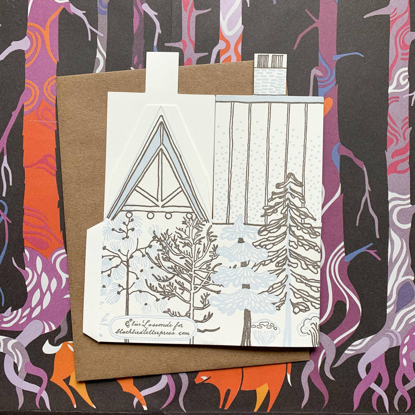 warmest greetings card, holiday cabin card, 3d house holiday card, winter cabin letterpress card, ice blue letterpress, forest brown letterpress, foldable holiday house card, buildable cabin card, die-cut Christmas card, miniature cabin card, artisan holiday stationery, Blackbird Letterpress holiday collection, Rogue & Rye holiday cards, winter greeting card, displayable paper craft card, Élise Lassonde illustration, A2 letterpress Christmas card