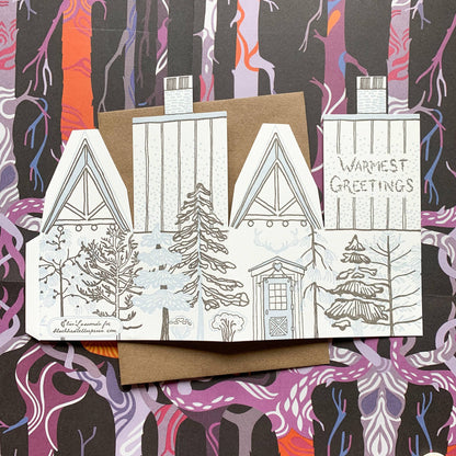 warmest greetings card, holiday cabin card, 3d house holiday card, winter cabin letterpress card, ice blue letterpress, forest brown letterpress, foldable holiday house card, buildable cabin card, die-cut Christmas card, miniature cabin card, artisan holiday stationery, Blackbird Letterpress holiday collection, Rogue & Rye holiday cards, winter greeting card, displayable paper craft card, Élise Lassonde illustration, A2 letterpress Christmas card