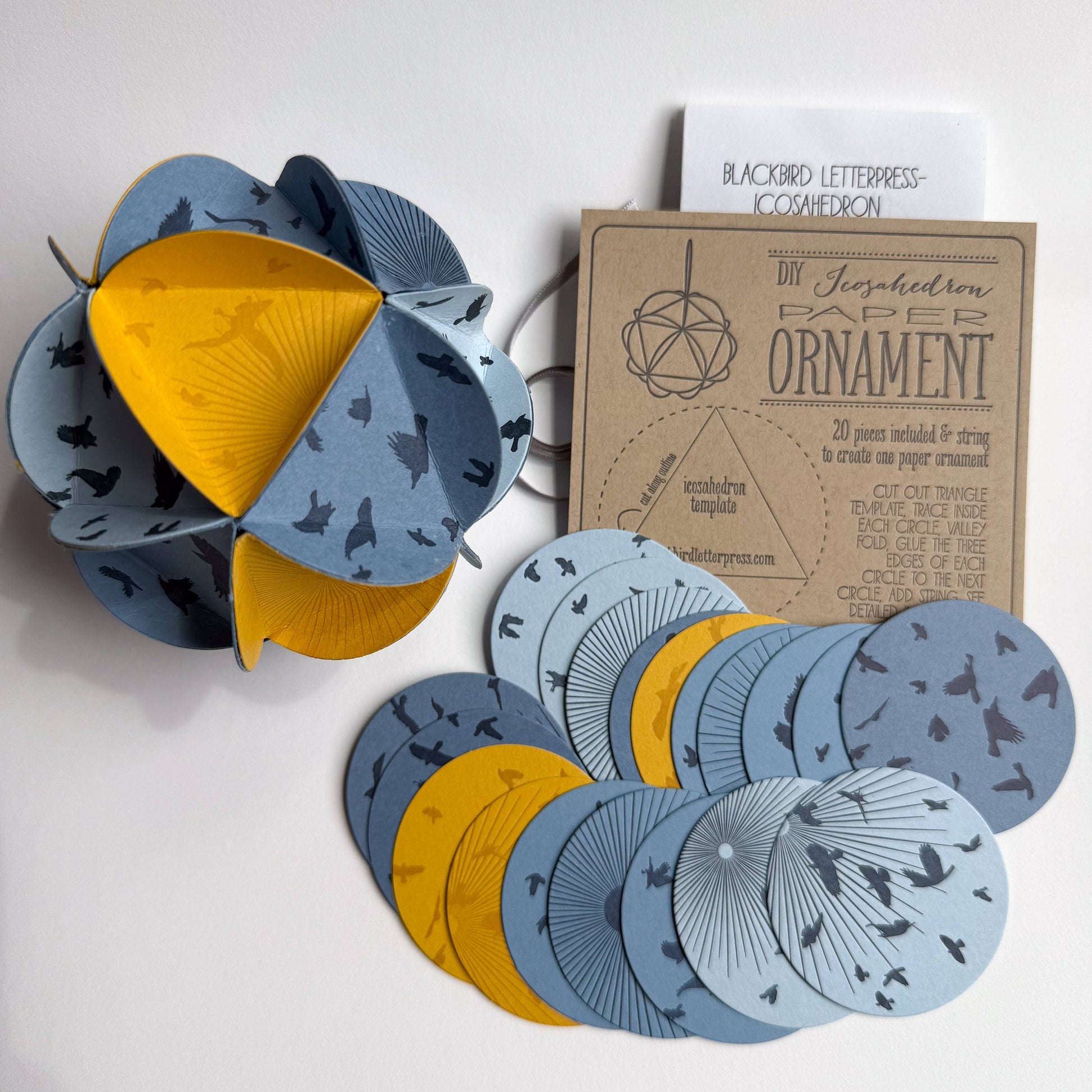 icosahedron ornament kit, diy paper ornament, winter solstice craft kit, letterpress ornament circles, geometric paper craft, holiday diy kit, blackbird letterpress kit, winter craft for kids and adults, paper ornament project, celestial ornament craft, 3d paper ornament kit, gift topper idea, handmade holiday craft, winter solstice decoration, rogue & rye craft kits, letterpress diy project, mindful crafting gift