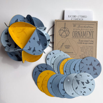 icosahedron ornament kit, diy paper ornament, winter solstice craft kit, letterpress ornament circles, geometric paper craft, holiday diy kit, blackbird letterpress kit, winter craft for kids and adults, paper ornament project, celestial ornament craft, 3d paper ornament kit, gift topper idea, handmade holiday craft, winter solstice decoration, rogue & rye craft kits, letterpress diy project, mindful crafting gift