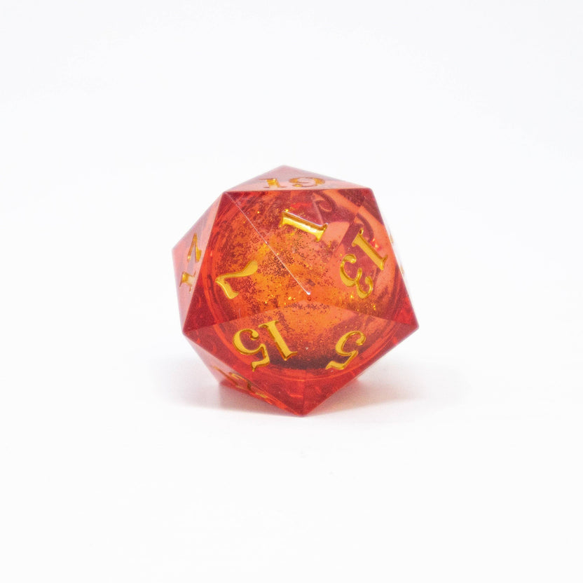 Large translucent pink d20 with swirling gold glitter liquid core
