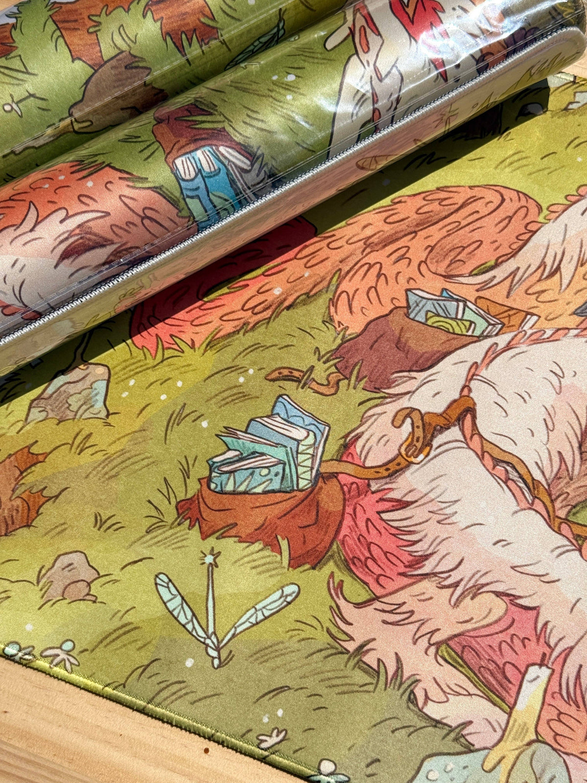 Book Dragon playmat detail with shaggy dragon curled around a reader