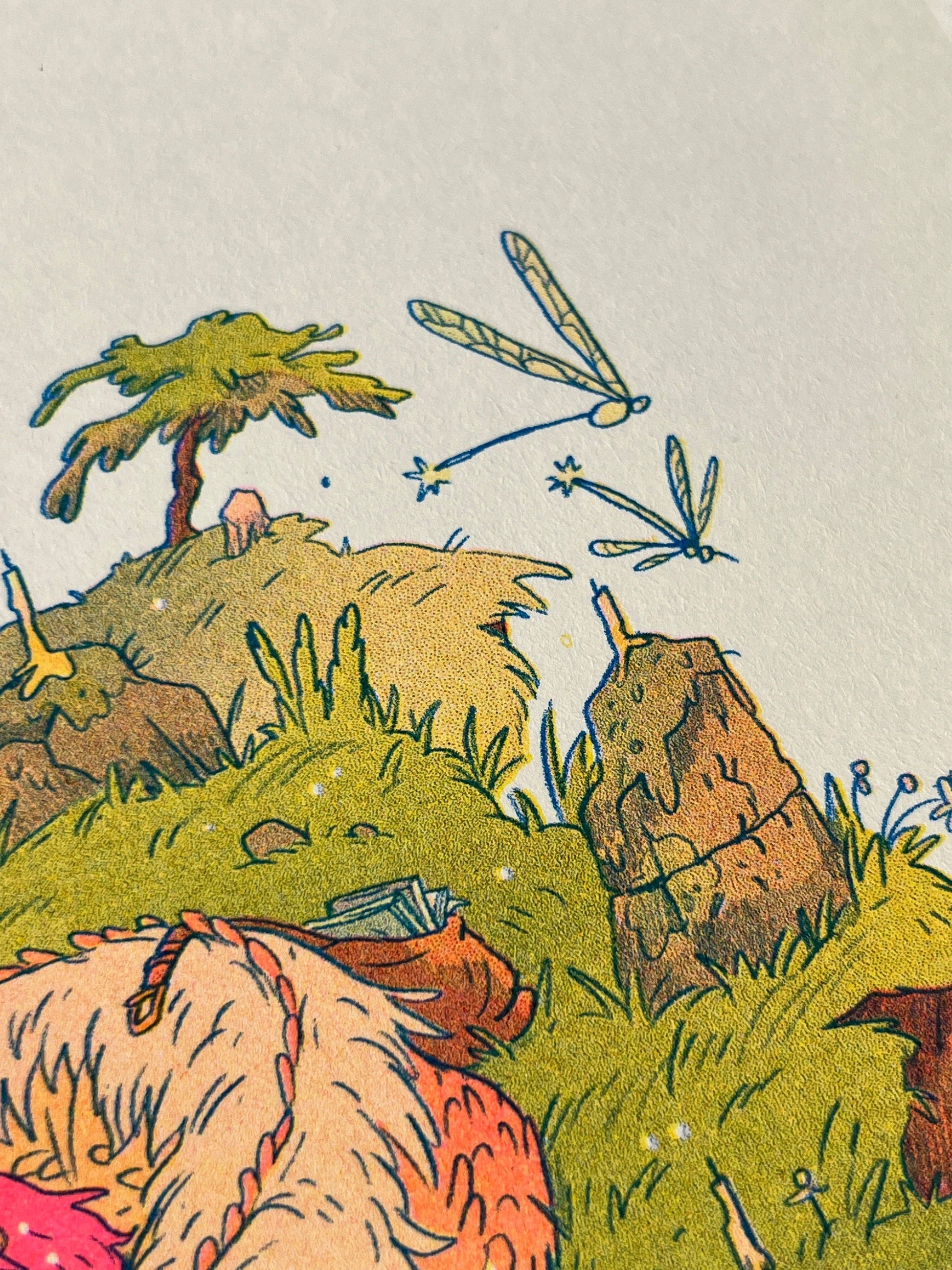 Book Dragon risograph print, Natalie Andrewson riso print, Thought Bubble Comic Festival art, reading dragon illustration, blue yellow fluorescent pink riso, fantasy creature artwork, book lover art print, whimsical dragon illustration, indie printmaker risograph, literary fantasy art, collectible riso print, Rogue & Rye artist collection.