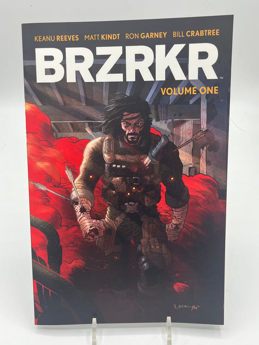Cover of BRZRKR Volume One by Keanu Reeves, Matt Kindt, and Ron Garney featuring the immortal warrior Berserker walking through a battlefield surrounded by red smoke.