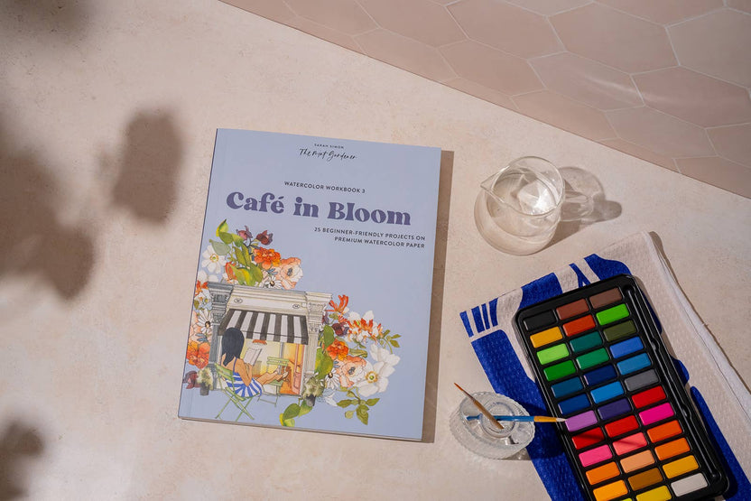 café watercolor workbook, garden watercolor book, beginner watercolor projects, Sarah Simon watercolor book, watercolor painting for adults, paint-in watercolor journal, floral watercolor scenes, cozy art projects, watercolor café illustrations, botanical watercolor practice