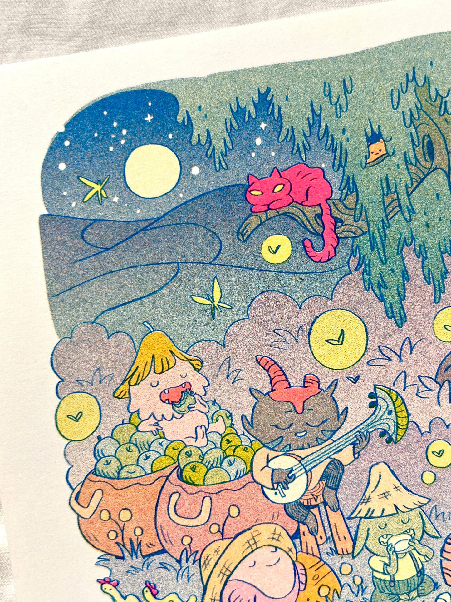 Campfire risograph print, woodland friends illustration, Natalie Andrewson riso art, blue yellow fluorescent pink riso, cozy forest scene artwork, campfire creature art, Patreon riso subscription print, indie printmaker risograph, square riso art, whimsical woodland illustration, collectible riso print, Rogue & Rye artist collection.