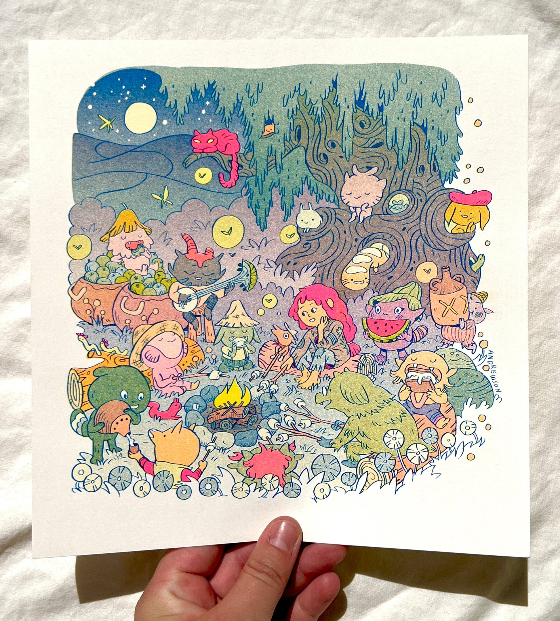 Campfire risograph print, woodland friends illustration, Natalie Andrewson riso art, blue yellow fluorescent pink riso, cozy forest scene artwork, campfire creature art, Patreon riso subscription print, indie printmaker risograph, square riso art, whimsical woodland illustration, collectible riso print, Rogue & Rye artist collection.
