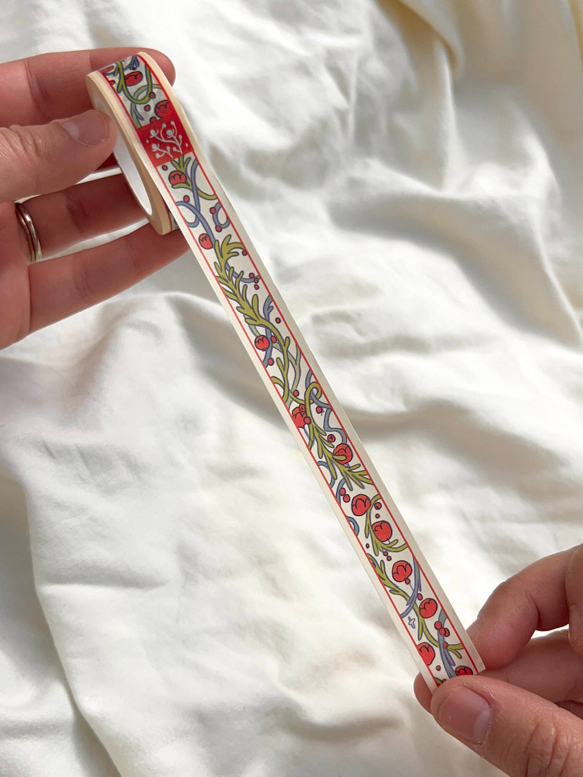 15 mm Chestnut Fairy washi tape extended between two hands