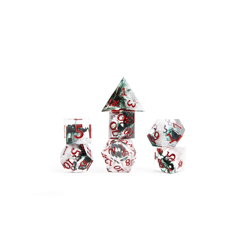 Laudna polyhedral dice grouped together, showing crystal-clear resin with suspended black details and red numbering