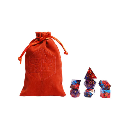 Critical Role Caleb Widogast Champion Dice Set by Darrington Press featuring maroon and blue sharp-edged resin dice with gold numbering.