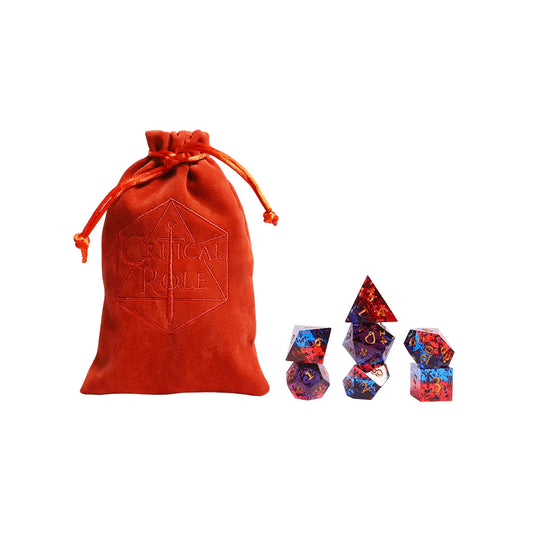 Critical Role Caleb Widogast Champion Dice Set by Darrington Press featuring maroon and blue sharp-edged resin dice with gold numbering.